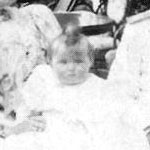 With Mama and Papa as a baby...